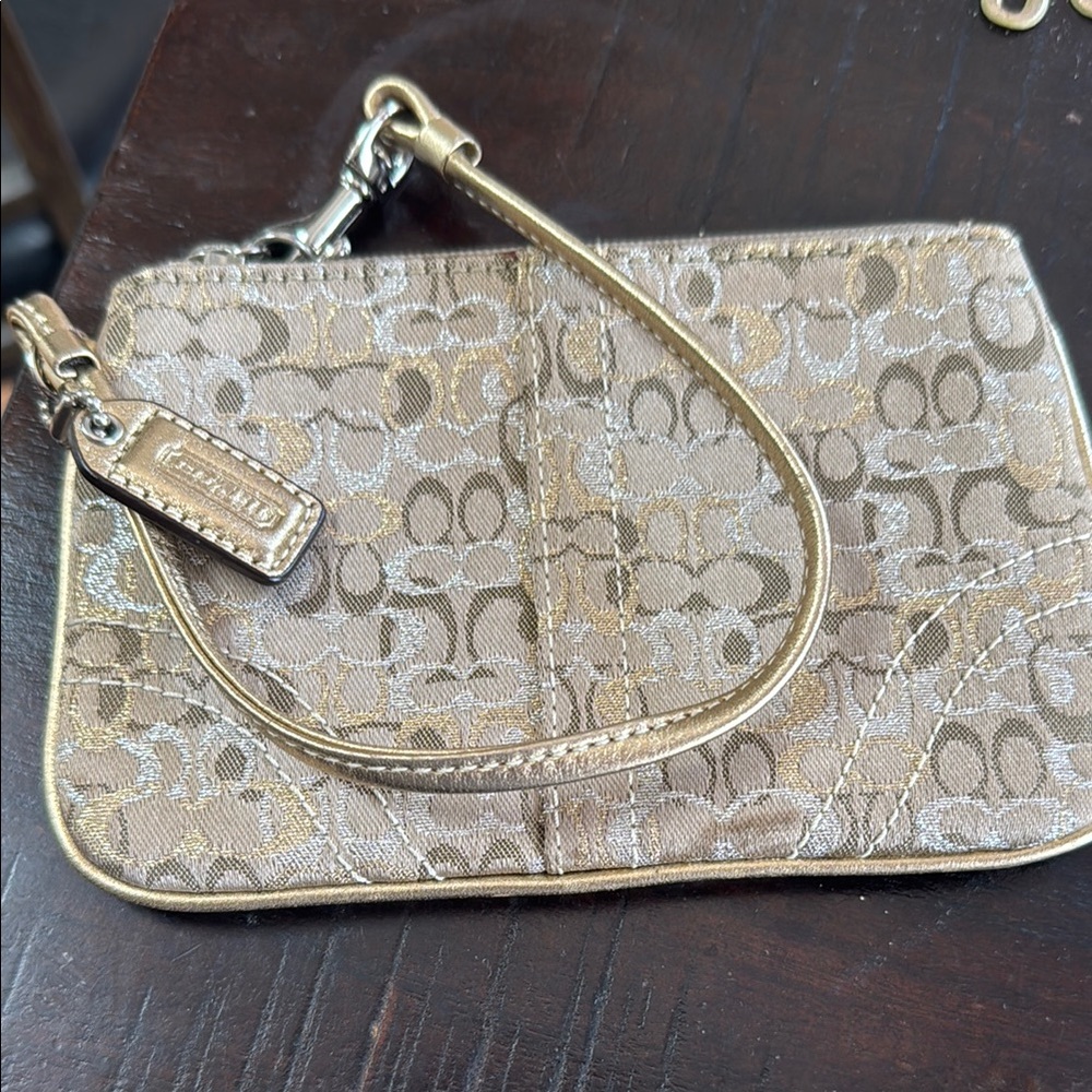 Coach Tan wristlet with Signature Monogram